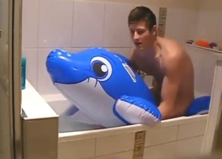 Inflatable dolphin bonk whole in tears for him